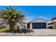 Charming single-story home with a well-maintained yard and a beautiful palm tree in front at 836 Cherry Dr, Henderson, NV 89002