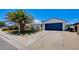 Charming single-story home with a well-manicured lawn and a spacious driveway at 836 Cherry Dr, Henderson, NV 89002