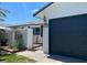 Attractive front exterior with a black garage door and a gated courtyard entrance at 836 Cherry Dr, Henderson, NV 89002
