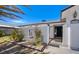 Exterior of the house with a gated entry and brick planter at 836 Cherry Dr, Henderson, NV 89002