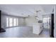 Spacious living area featuring a modern kitchen, fireplace, and glass panel doors at 836 Cherry Dr, Henderson, NV 89002