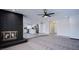 Cozy living room with a fireplace, modern flooring, and seamless access to the modern kitchen at 836 Cherry Dr, Henderson, NV 89002