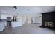 Bright and open living space with a modern kitchen, fireplace, and modern flooring at 836 Cherry Dr, Henderson, NV 89002