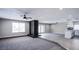 Inviting living room featuring a brick fireplace, and a modern kitchen in an open concept at 836 Cherry Dr, Henderson, NV 89002