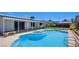 Stunning backyard featuring a sparkling pool and jacuzzi surrounded by a spacious patio area at 836 Cherry Dr, Henderson, NV 89002