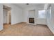 Spacious living room with cozy fireplace and natural light at 8771 Martinique Bay Ln, Las Vegas, NV 89147