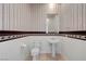 Powder bathroom with vintage wall paper, pedestal sink, and tile flooring at 905 Star Pine Dr, Las Vegas, NV 89144
