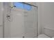 Modern bathroom featuring a glass-enclosed shower with chrome fixtures at 905 Star Pine Dr, Las Vegas, NV 89144
