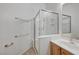 Modern bathroom featuring a glass-enclosed shower and vanity with sink at 905 Star Pine Dr, Las Vegas, NV 89144