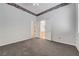 Spacious bedroom featuring neutral carpeting and an open doorway at 905 Star Pine Dr, Las Vegas, NV 89144