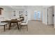 Elegant dining room showcasing sophisticated decor and seamless flow to the entryway at 905 Star Pine Dr, Las Vegas, NV 89144
