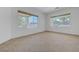 Sun-filled room with two large windows offering views of the backyard and neighborhood at 905 Star Pine Dr, Las Vegas, NV 89144
