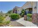 Inviting home with manicured landscaping, desert rock accents, and a secure entrance at 905 Star Pine Dr, Las Vegas, NV 89144