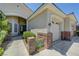 Beautiful home exterior featuring brick accents, lush landscaping, and a security system at 905 Star Pine Dr, Las Vegas, NV 89144