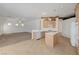 Open kitchen with a breakfast bar, tile floors, wooden cabinetry, and lots of space at 905 Star Pine Dr, Las Vegas, NV 89144