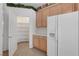 Bright kitchen shows pantry, tile flooring, stainless appliances, and a built-in countertop at 905 Star Pine Dr, Las Vegas, NV 89144