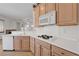 Kitchen featuring stainless appliances, cooktop, and a view into the living room at 905 Star Pine Dr, Las Vegas, NV 89144