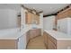 Bright kitchen featuring tile floors, ample counter space, light wood cabinetry, and modern white appliances at 905 Star Pine Dr, Las Vegas, NV 89144