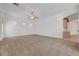 A large carpeted living room with recessed lights, a ceiling fan, and large open space at 905 Star Pine Dr, Las Vegas, NV 89144