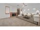 Inviting living room with a cozy fireplace, neutral decor, and carpet flooring throughout at 905 Star Pine Dr, Las Vegas, NV 89144