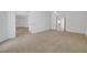 Expansive main bedroom with neutral carpeting and views into adjacent rooms at 905 Star Pine Dr, Las Vegas, NV 89144