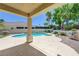 Charming pool and hot tub with covered patio and well-manicured garden perfect for outdoor relaxation at 905 Star Pine Dr, Las Vegas, NV 89144