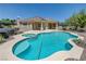 Backyard oasis features a sparkling pool, built-in grill, and shaded patio for perfect outdoor relaxation and entertainment at 905 Star Pine Dr, Las Vegas, NV 89144
