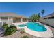 Outdoor pool and hot tub combination surrounded by well-kept landscaping offering a private and serene backyard escape at 905 Star Pine Dr, Las Vegas, NV 89144