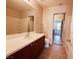 Bathroom featuring tile flooring, a vanity with dark cabinets, and a shower-tub combination at 9069 Tantalizing Ave, Las Vegas, NV 89149