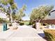Inviting community green space featuring lush lawns, mature trees, and walking paths at 9069 Tantalizing Ave, Las Vegas, NV 89149