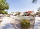 Community playground featuring climbing and play structure with shade in a neighborhood area at 9069 Tantalizing Ave, Las Vegas, NV 89149