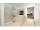 Elegant bathroom with a soaking tub, separate glass shower, and tile surround at 9660 Drayton Ave, Las Vegas, NV 89148