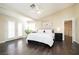 Bedroom features hardwood floors, ceiling fan, and french doors at 9660 Drayton Ave, Las Vegas, NV 89148