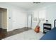 Bedroom features hardwood floors, neutral color scheme, a full length mirror and double door closet at 9660 Drayton Ave, Las Vegas, NV 89148