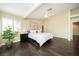 Bedroom features hardwood floors, ceiling fan, neutral color scheme, and a large window with shutters at 9660 Drayton Ave, Las Vegas, NV 89148