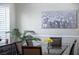 Dining room with decorative artwork and a modern sideboard cabinet at 9660 Drayton Ave, Las Vegas, NV 89148