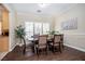 Dining room with a rustic wooden table and stylish window shutters at 9660 Drayton Ave, Las Vegas, NV 89148