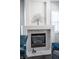 Living room fireplace with stylish mantel and decorative wall art at 9660 Drayton Ave, Las Vegas, NV 89148