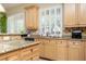 Updated kitchen features a large sink and granite counters at 9660 Drayton Ave, Las Vegas, NV 89148
