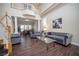 Comfortable living room featuring hardwood floors and stylish gray sofas at 9660 Drayton Ave, Las Vegas, NV 89148