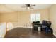 Loft area with hardwood floors, ceiling fan, and a window with shutters at 9660 Drayton Ave, Las Vegas, NV 89148