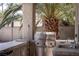 Outdoor kitchen with stainless steel appliances and a built in grill at 9660 Drayton Ave, Las Vegas, NV 89148