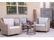 Outdoor seating area with comfortable wicker furniture and neutral-colored cushions at 9660 Drayton Ave, Las Vegas, NV 89148
