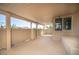 A covered patio with a view of palm trees in the background at 9660 Drayton Ave, Las Vegas, NV 89148