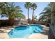 Sparkling backyard pool with lush palm trees, perfect for outdoor enjoyment at 9660 Drayton Ave, Las Vegas, NV 89148