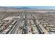 Expansive overhead shot of a residential community showcases the layout and design, and mountain views on the horizon at 9950 Coyote Echo Ct, Las Vegas, NV 89166