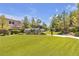 Well-manicured community green space with landscaping, walking paths, and benches at 9950 Coyote Echo Ct, Las Vegas, NV 89166