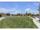 Well-maintained community green space with playground in the background at 9950 Coyote Echo Ct, Las Vegas, NV 89166