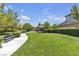 Serene community park with walking paths, lush greenery, and benches at 9950 Coyote Echo Ct, Las Vegas, NV 89166