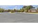 View of Teton's entryway gate with landscaping and a clear road in at 9950 Coyote Echo Ct, Las Vegas, NV 89166